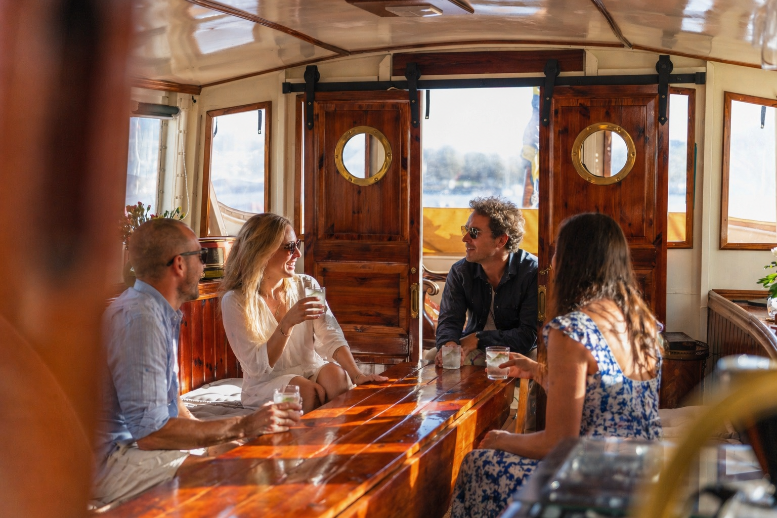 Guests enjoying drinks in M/S Maryonette's saloon